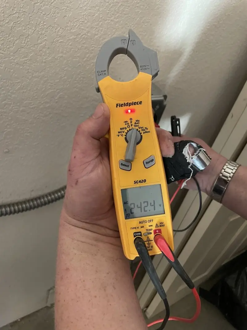 Voltage testing with clamp meter during Electrical Installation Services in Long Beach